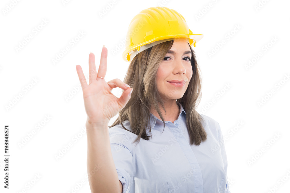 Portrait of female constructor showing ok gesture. Portrait of female constructor showing ok gesture.