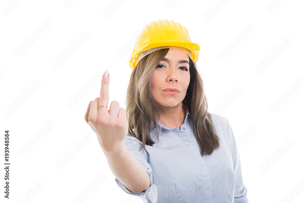 Portrait of female constructor showing obscene gesture. Portrait of female constructor showing obscene gesture.
