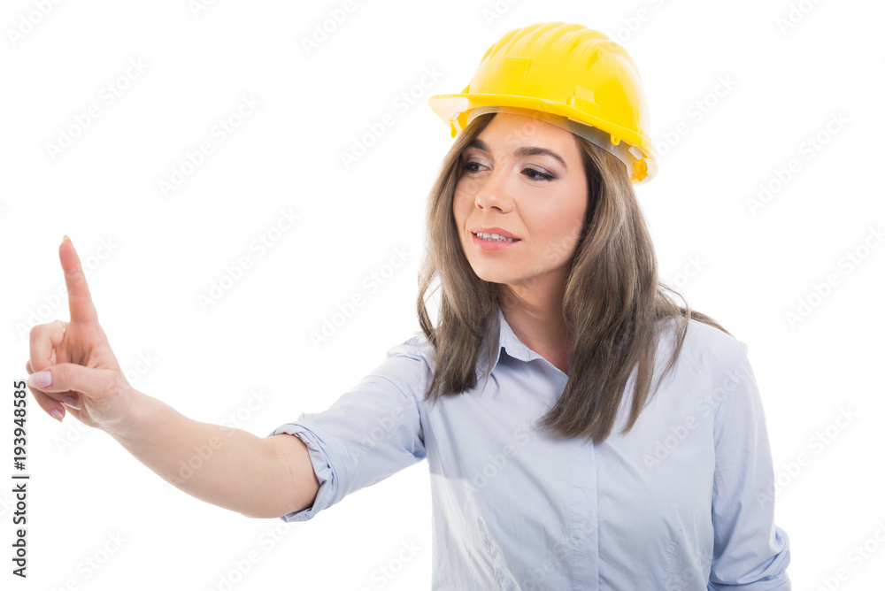Portrait of female constructor sliding with index finger.