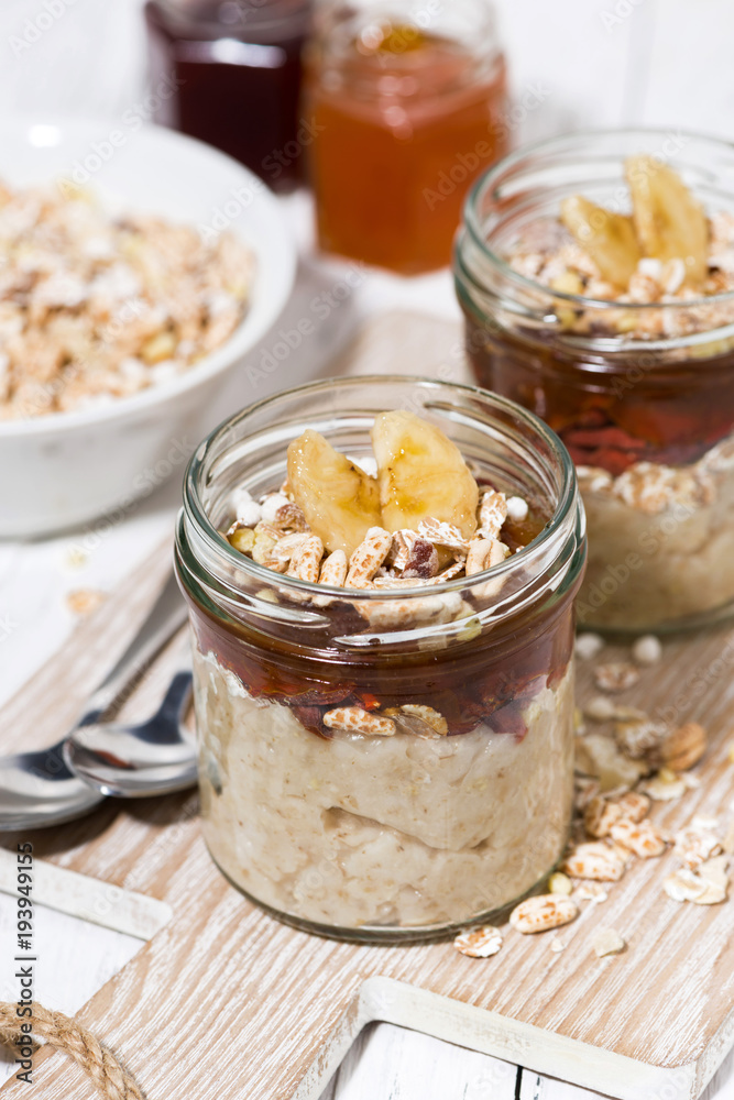 sweet oat pudding with jam and bananas, top view closeup sweet oat pudding with jam and bananas, top view closeup