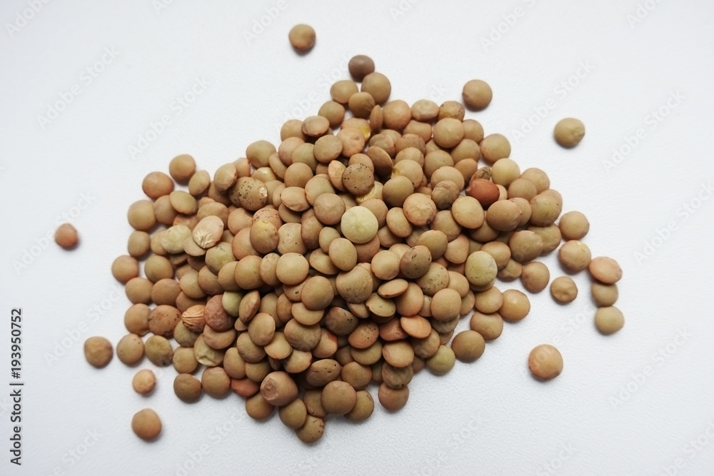 Close up of a pile of raw lentils, isolated on white background
Close up of a pile of raw lentils, isolated on white background