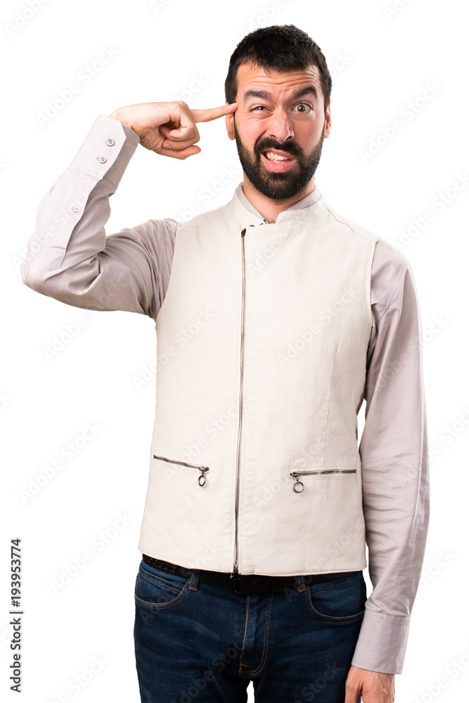 Handsome man with vest making crazy gesture on isolated white background Handsome man with vest making crazy gesture on isolated white background