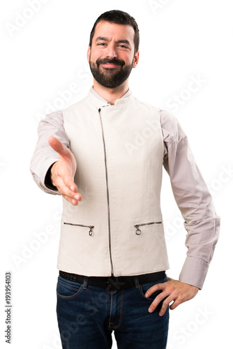 Handsome man with vest making a deal on isolated white background