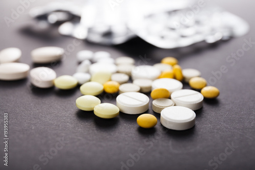Pills close up on black background