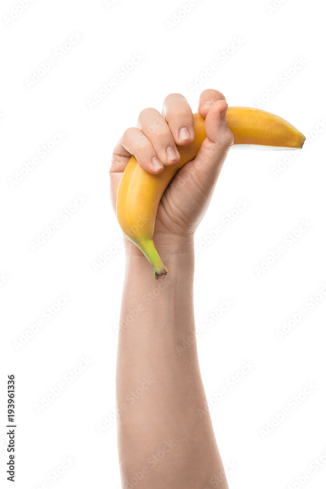 Banana. Male hand holding banana. Isolated on white background. Banana. Male hand holding banana. Isolated on white background.