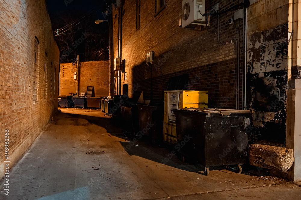 Dark empty scary urban city street alley with dumpsters and vintage