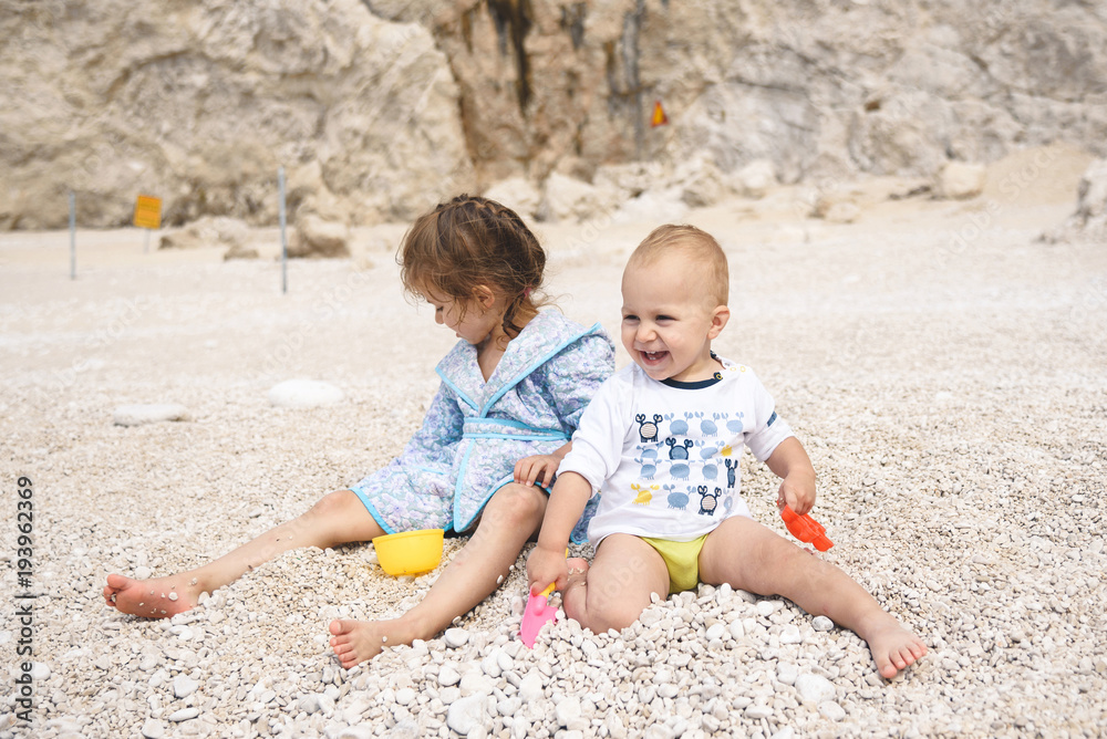 Laughing Boy and Girl on Beach Laughing Boy and Girl on Beach