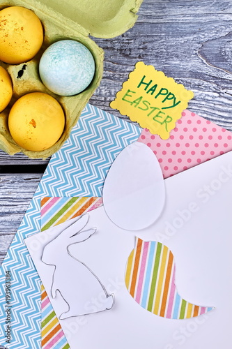 Patterned paper and Easter eggs. Yellow Easter greeting card and papercut figures. Easy Easter ornaments ideas.
