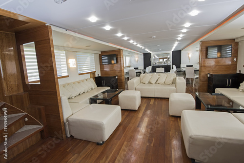Interior of large salon area of luxury motor yacht © Paul Vinten