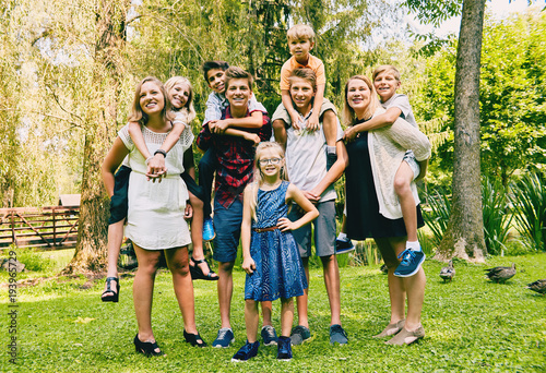 Adult siblings with little sisters and brothers