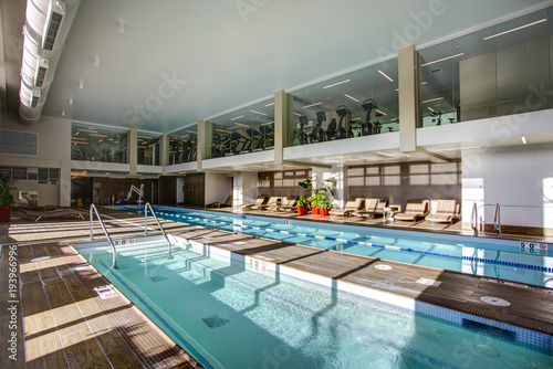 Upscale Indoor swimming pool in condominium complex. photo