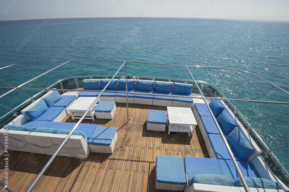 Fototapeta premium Table and chairs on deck of a luxury motor yacht