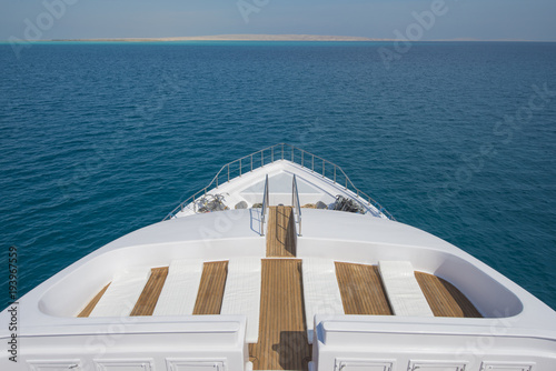 View over the bow over a large luxury motor yacht © Paul Vinten