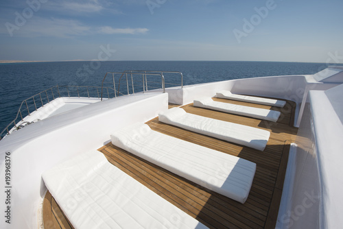 View over the bow over a large luxury motor yacht © Paul Vinten
