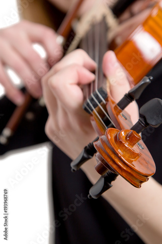 hands of a girl playing a violin isolated on a white background