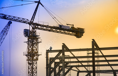 Silhouette construction site and worker.