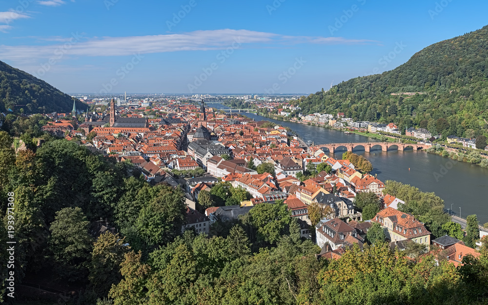 View of Heidelberg Old Town with Jesuit Church, Church of the Holy Spirit and Old Bridge (Karl Theodor Bridge) across Neckar river in autumn sunny day, Germany
