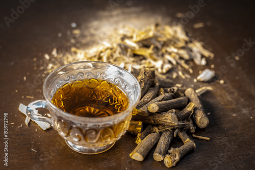 Ayurvedic herb Liquorice root,Licorice root, Mulethi or Glycyrrhiza glabra root and its powder with its tea for detoxifying the body, soothing spasms, easing menstrual cramps, raising blood pressure.