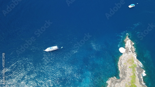 Aerial photo tropical island and dive boats in Thailand