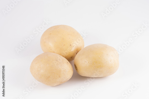 Some potatoes on a white surface