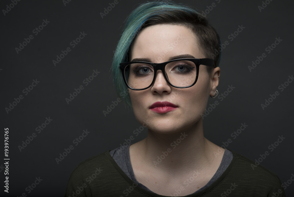 closeup portrait of young short haired woman. lgbt activist