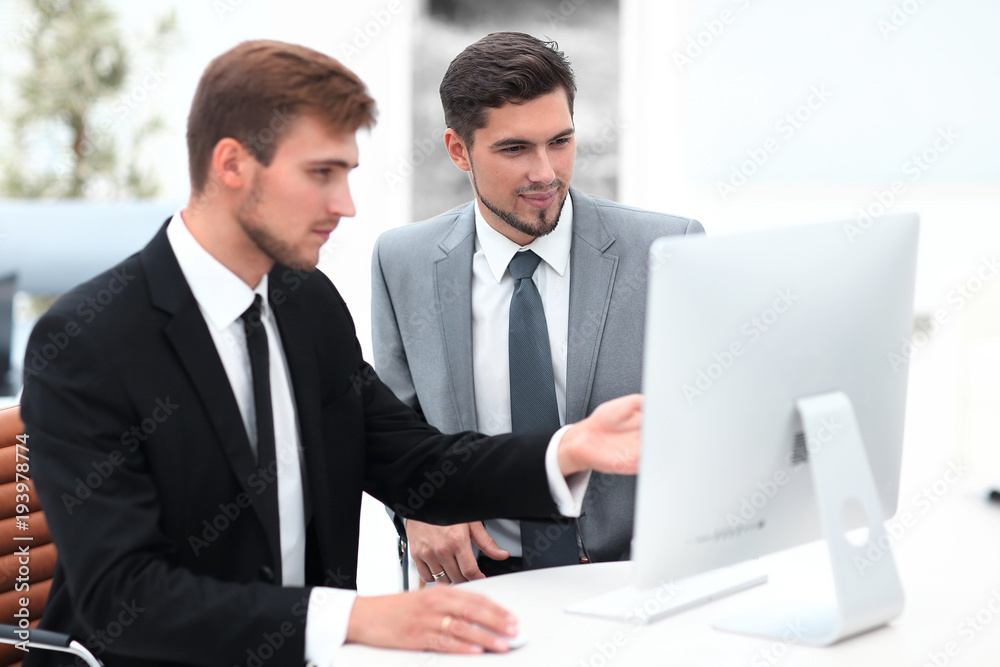 employees are talking sitting behind a Desk employees are talking sitting behind a Desk