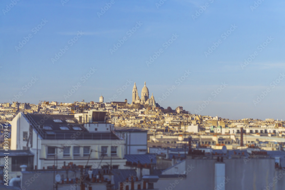 A view of the sacre coeur across the city of Paris, France
