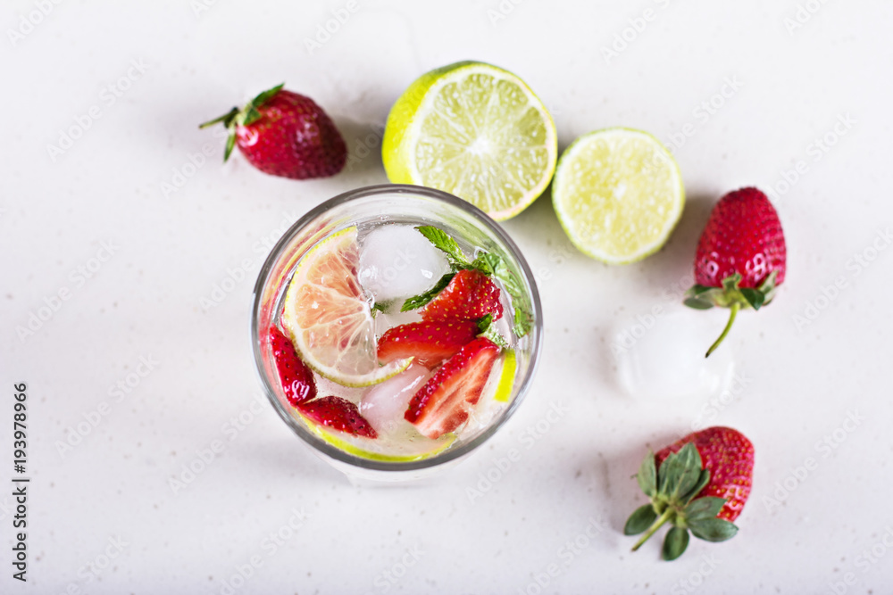 Lemonade with strawberries and lime.