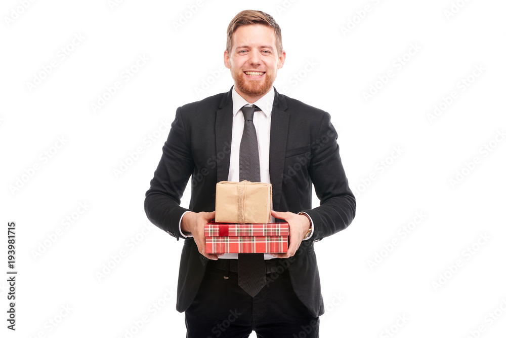 Portrait of young businessman in black suit holding gift boxes on white background Portrait of young businessman in black suit holding gift boxes on white background