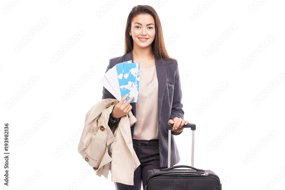 Portrait of young businesswoman posing with her suitcase before departure Portrait of young businesswoman posing with her suitcase before departure