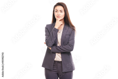 Portrait of emotional Asian businesswoman posing on white background