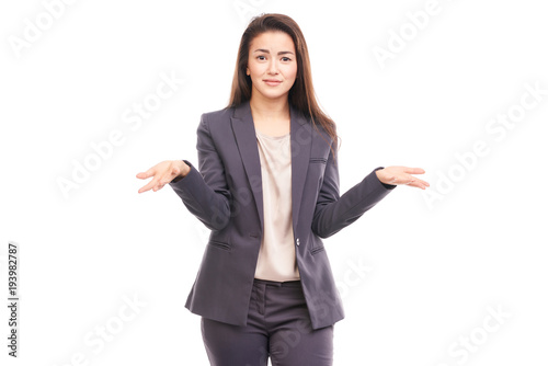 Portrait of emotional Asian businesswoman posing on white background