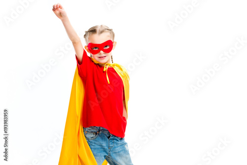 Quadro su tela Supergirl wearing yellow cape and red mask for eyes gesturing by hand isolated o