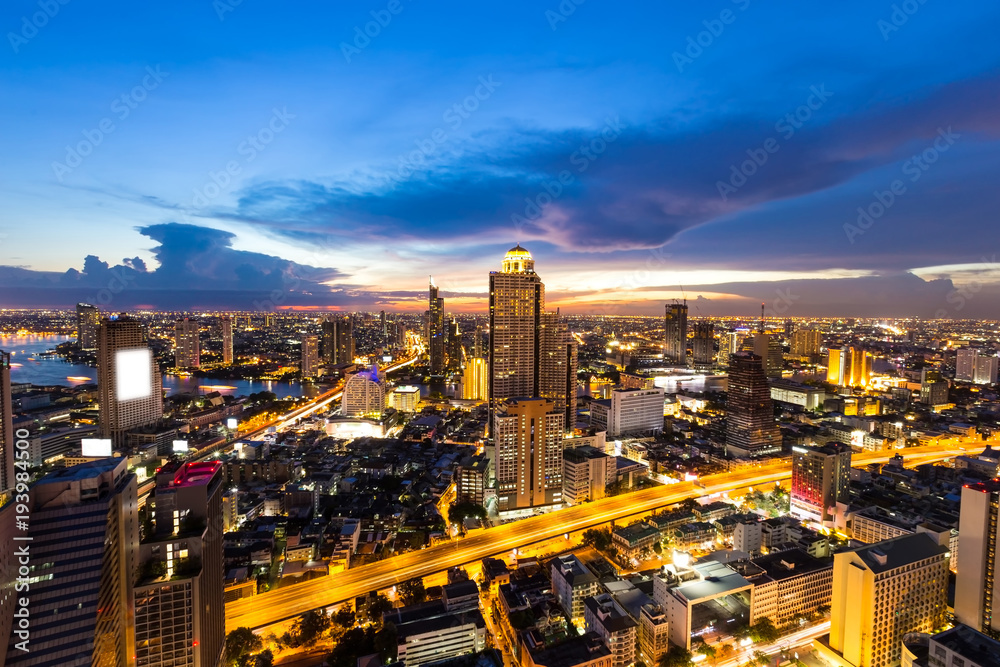 Fototapeta premium Panoramic view during twilight sky scene of roof top with expressway in the landmark aerial of city in Bangkok