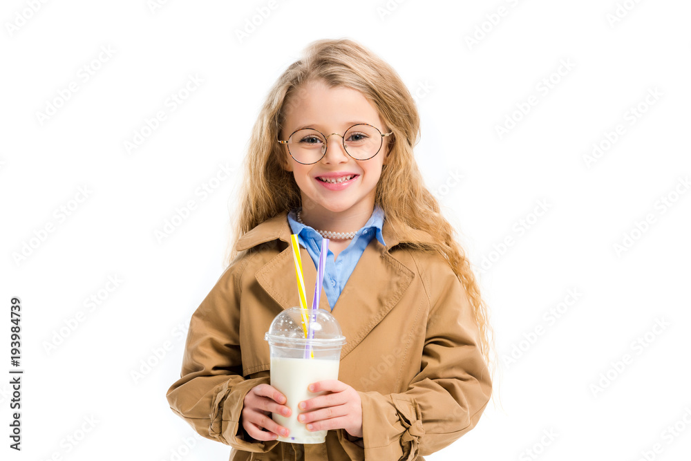 Little smiling kid in glasses holding milkshake isolated on white Little smiling kid in glasses holding milkshake isolated on white