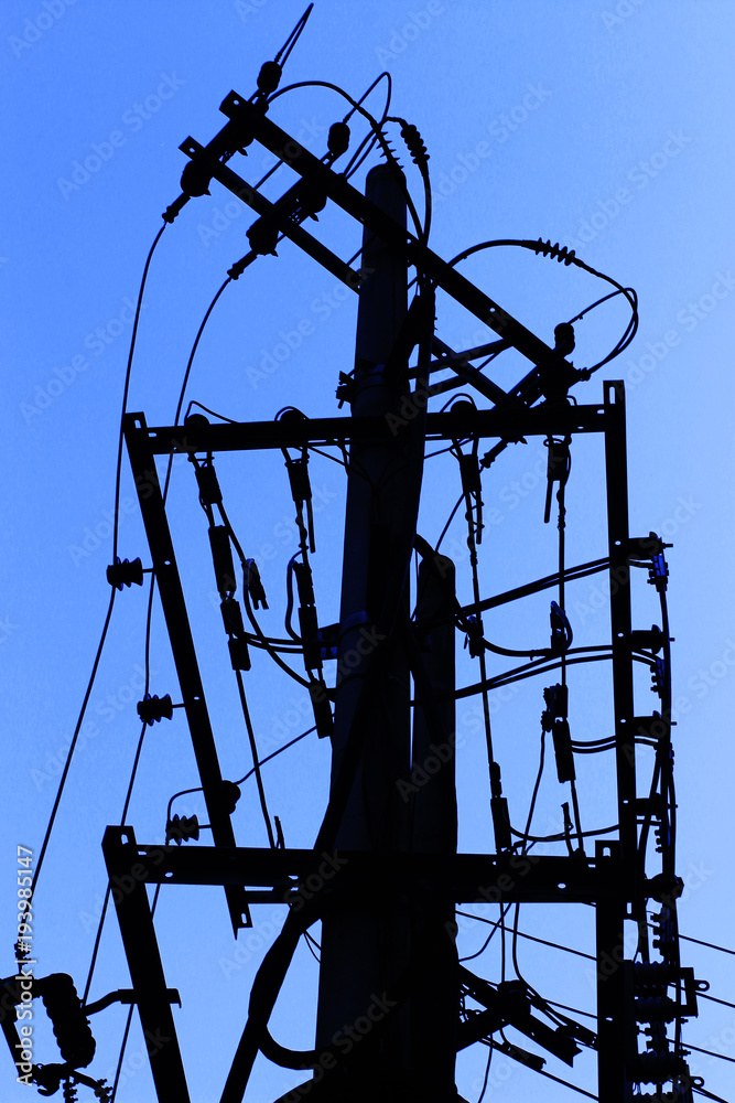 Silhouette of poles and wires in the city Silhouette of poles and wires in the city
