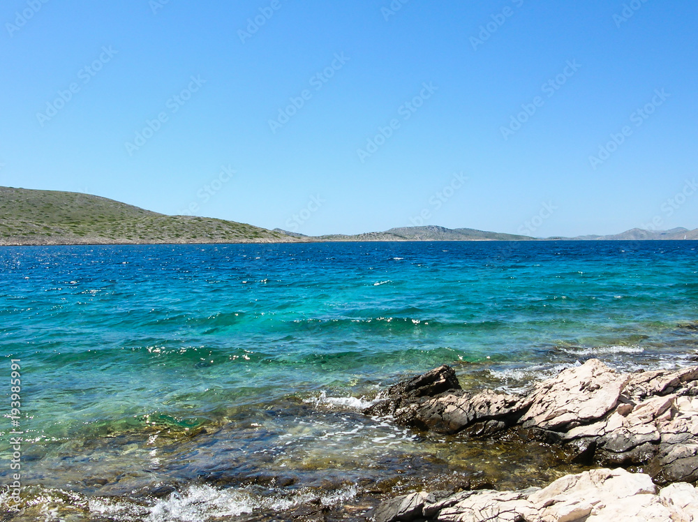 Beautiful natural rock arch near of sea. Amazing blue green sea and sunny day. Beautiful natural rock arch near of sea. Amazing blue green sea and sunny day.