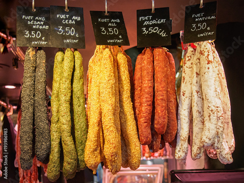 Several Fuet sauseges on the La Boqueria Market in Barcelona. Fuet is a Catalan thin, dry cured, sausage.
