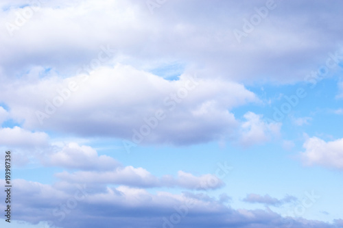 Light Blue sky with white cumulus clouds background © annettbro