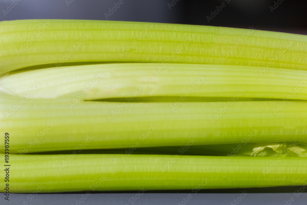 fresh juicy celery closeup on dark background fresh juicy celery closeup on dark background