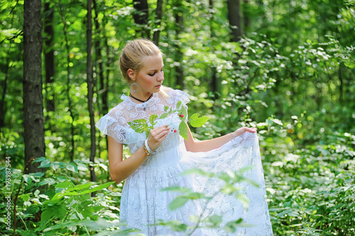 Young victorian lady in white dress photo