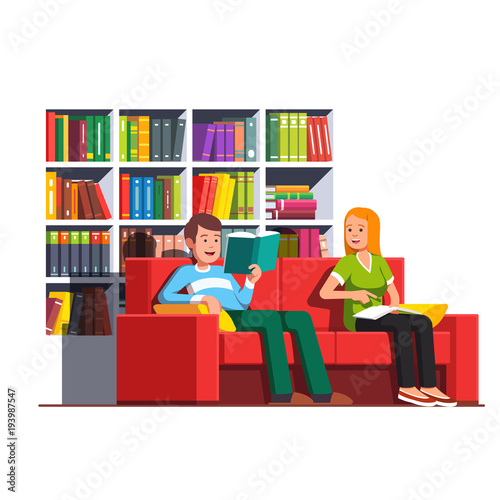 Family couple reading books sitting on couch