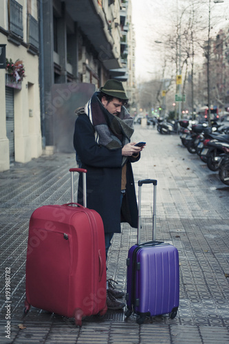 Man with luggage on Barcelona Streets