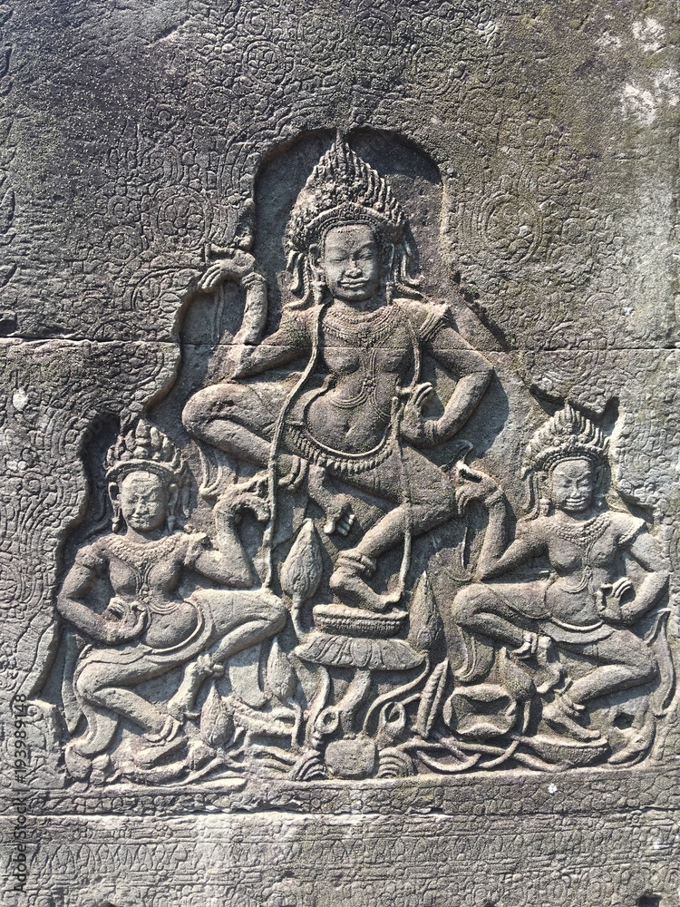 Apsara dancers carved on the wall of Khmer ancient temple.  Angkor Wat in Siem Reap, Cambodia. 