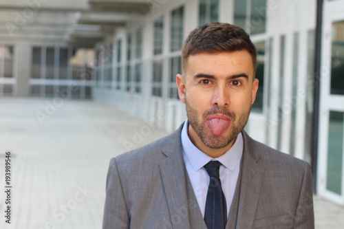 Fotografija Crazy employee sticking tongue out