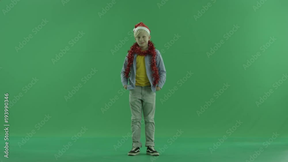 Boy shows thumb finger, green chroma key background Boy shows thumb finger, green chroma key background