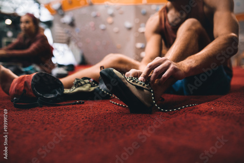 Man wearing wall climbing shoes