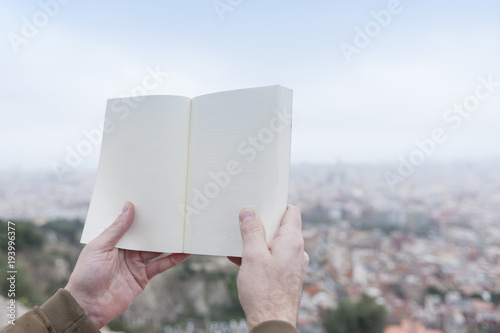 hands holding a book