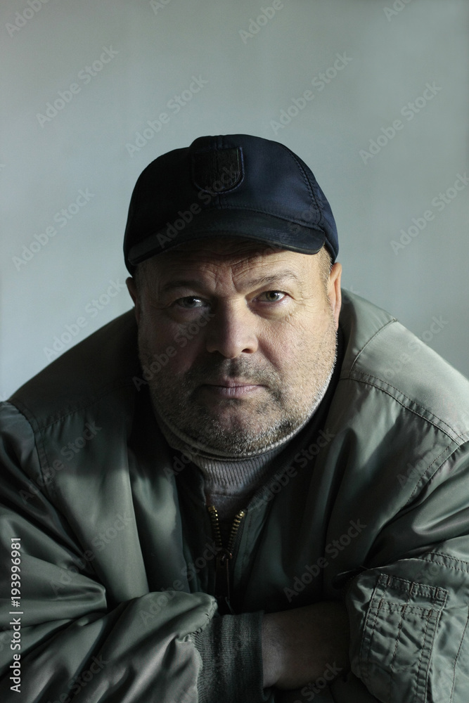 portrait of unshaven angry 50-year-old man portrait of unshaven angry 50-year-old man