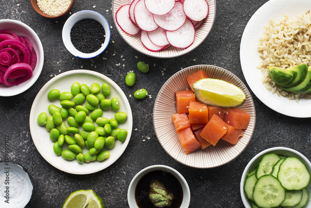 Fresh ingredients for rice edamame salmon poke bowl. Top view. Fresh ingredients for rice edamame salmon poke bowl. Top view.